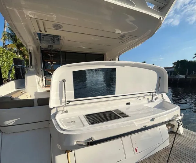 510 Schaefer Yacht Photos Pics Schaefer 510 yacht's outdoor kitchen area with grill, 2019 model, docked by water.