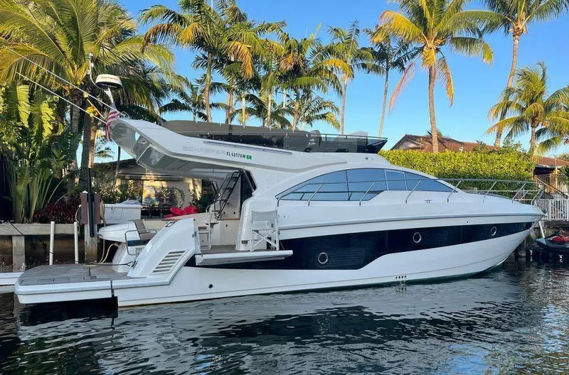 510 Schaefer Yacht Photos Pics 2019 Schaefer 510 yacht docked by palm trees, sunny day.