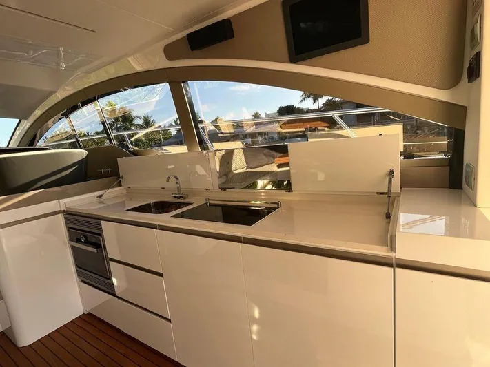 510 Schaefer Yacht Photos Pics Luxurious kitchen area on a 2019 Schaefer 510 yacht with modern appliances and sleek design.