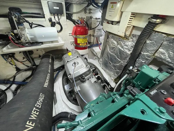 510 Schaefer Yacht Photos Pics Engine room of a 2019 Schaefer 510 yacht with visible machinery and fire extinguisher.
