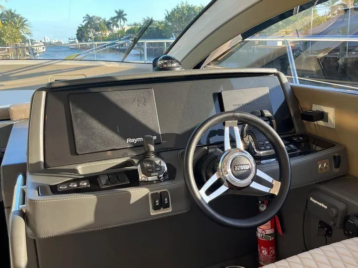 510 Schaefer Yacht Photos Pics Interior of a 2019 Schaefer 510 yacht cockpit with steering wheel and navigation controls.