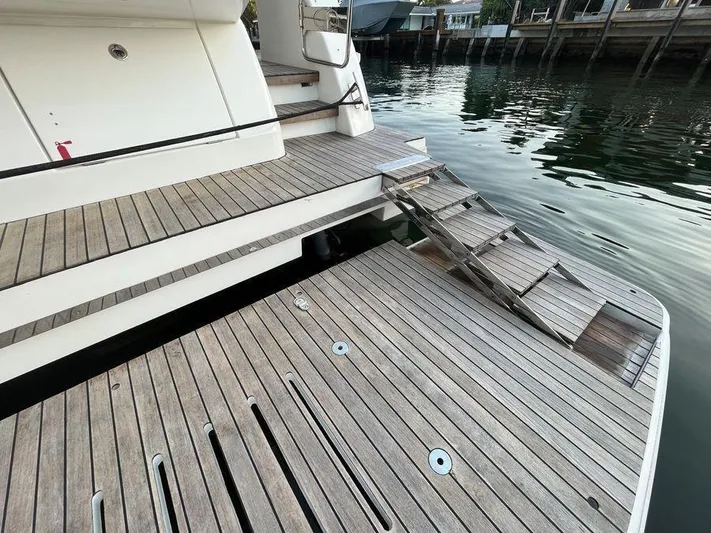 510 Schaefer Yacht Photos Pics Schaefer 510 yacht's wooden deck and steps, 2019 model, docked by the water.
