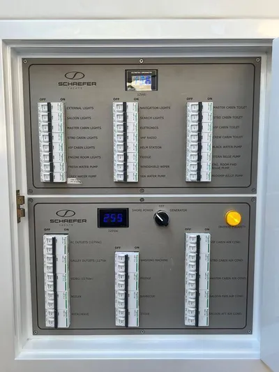 510 Schaefer Yacht Photos Pics Electrical control panel of a 2019 Schaefer 510 yacht, featuring switches and voltage display.