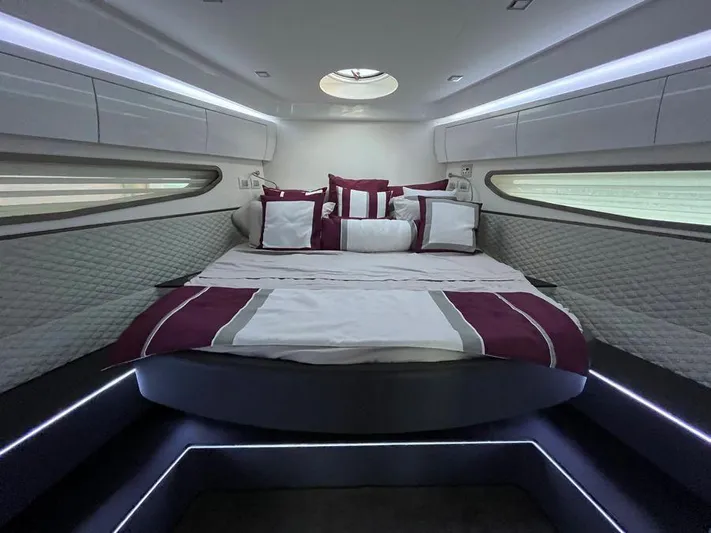 510 Schaefer Yacht Photos Pics Luxurious cabin interior of 2019 Schaefer 510 yacht with elegant bedding and ambient lighting.