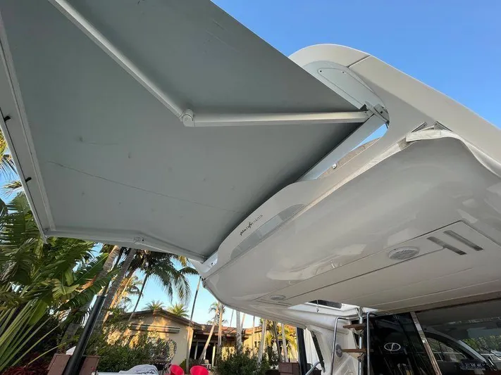 510 Schaefer Yacht Photos Pics Schaefer 510 yacht awning, 2019 model, extended under clear blue sky.