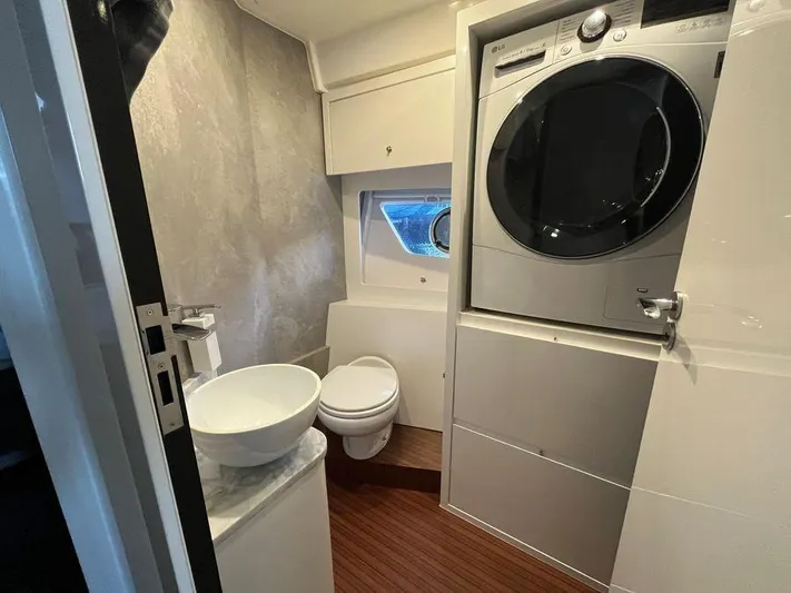 510 Schaefer Yacht Photos Pics Compact bathroom in 2019 Schaefer 510 yacht with washer-dryer, sink, and toilet.