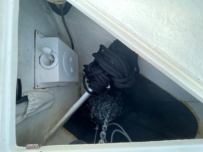 510 Schaefer Yacht Photos Pics Storage compartment in a 2019 Schaefer 510 boat with ropes and equipment.