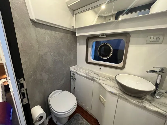 510 Schaefer Yacht Photos Pics Luxurious bathroom in 2019 Schaefer 510 yacht with modern fixtures and marble countertop.