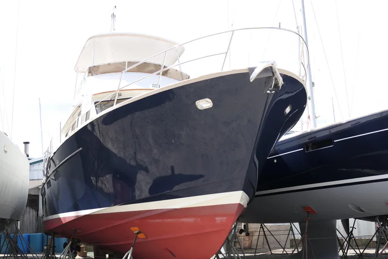 Whirlaway Yacht Photos Pics Alden Motor Yacht 2020 model, docked and elevated, showcasing sleek design and craftsmanship.