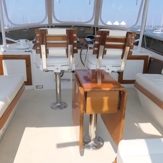 Whirlaway Yacht Photos Pics Interior of 2020 Alden Motor Yacht with wooden and white seating.