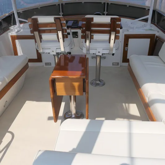 Whirlaway Yacht Photos Pics Luxurious 2020 Alden Motor Yacht interior with elegant seating and polished wood accents.