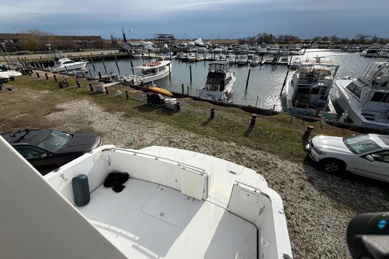  Yacht Photos Pics 2003 Carver 564 Cockpit Motor Yacht docked at a marina with multiple boats.
