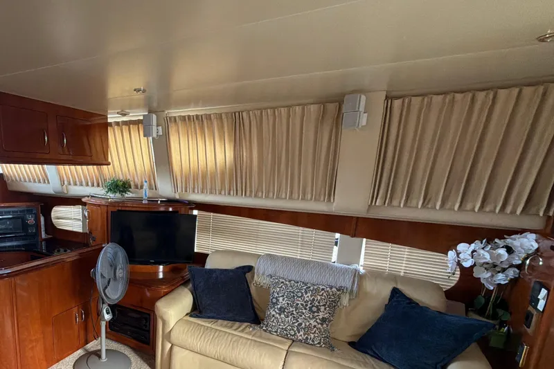  Yacht Photos Pics Luxurious interior of 2003 Carver 564 Cockpit Motor Yacht with cozy seating and elegant decor.