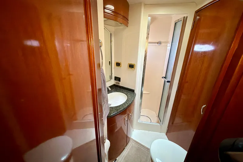  Yacht Photos Pics Luxurious bathroom in 2003 Carver 564 Cockpit Motor Yacht with shower and vanity.