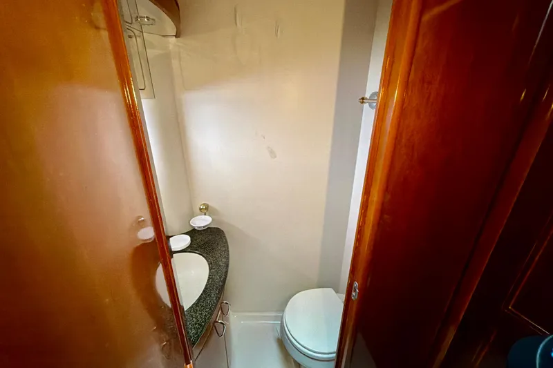  Yacht Photos Pics 2003 Carver 564 Cockpit Motor Yacht bathroom with sink and toilet.