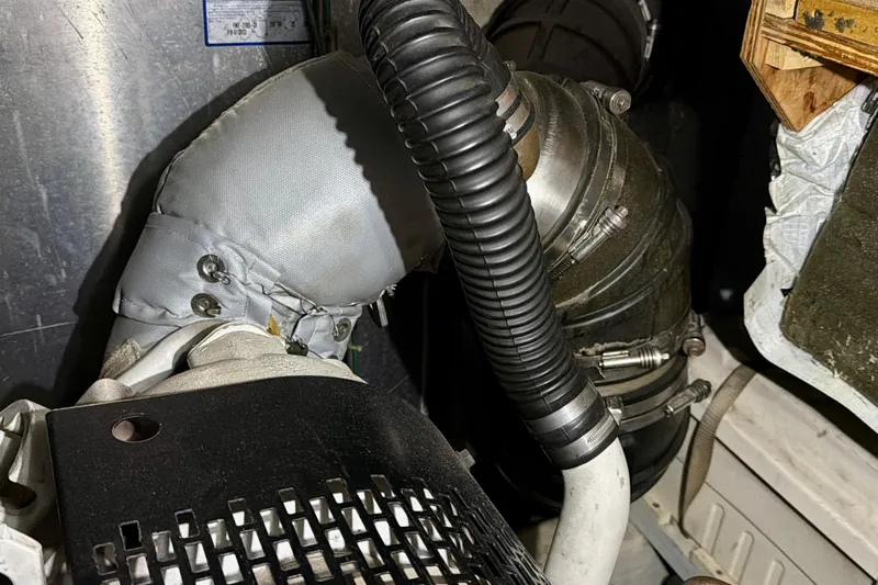  Yacht Photos Pics Engine compartment of a 2003 Carver 564 Cockpit Motor Yacht, showing hoses and components.