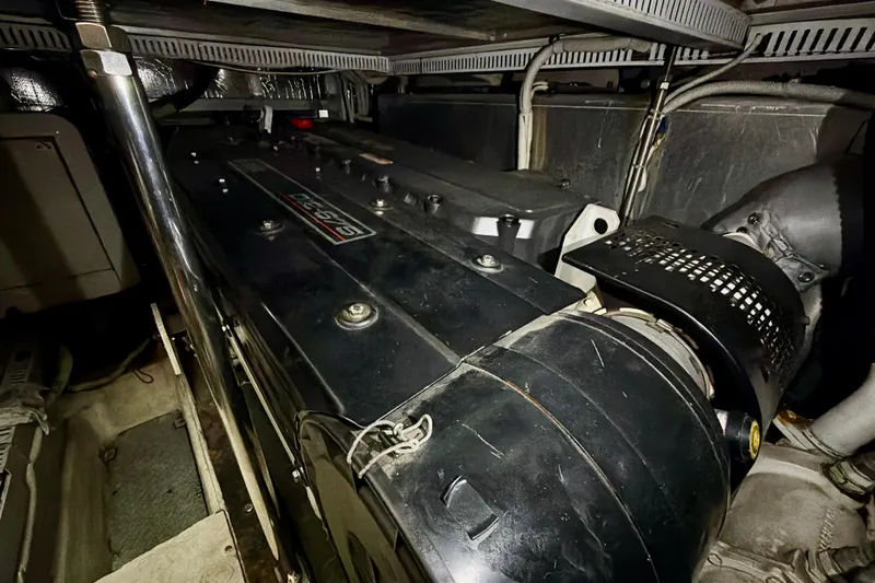  Yacht Photos Pics Engine room of 2003 Carver 564 Cockpit Motor Yacht, showcasing mechanical components.