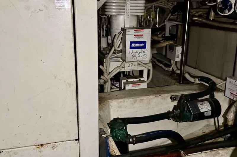  Yacht Photos Pics Engine room of 2003 Carver 564 Cockpit Motor Yacht with visible machinery and wiring.