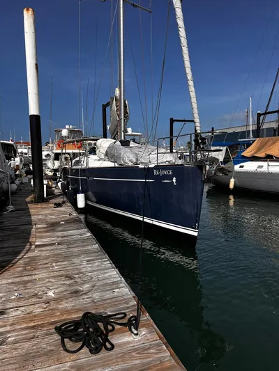Rejoyce Yacht Photos Pics Beneteau Oceanis 54 sailboat docked at marina, 2010 model, named "Re-Joyce".