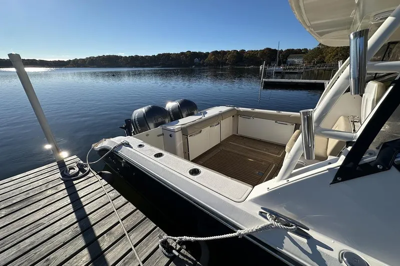 Soul Mates Yacht Photos Pics 2016 Pursuit DC 325 Dual Console boat docked on a serene lake.
