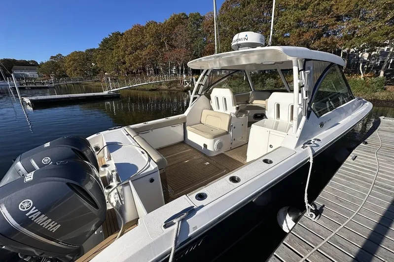 Soul Mates Yacht Photos Pics 2016 Pursuit DC 325 Dual Console boat docked, featuring Yamaha engines and spacious seating.