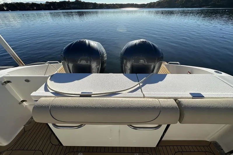 Soul Mates Yacht Photos Pics 2016 Pursuit DC 325 Dual Console boat with twin engines on a serene lake.