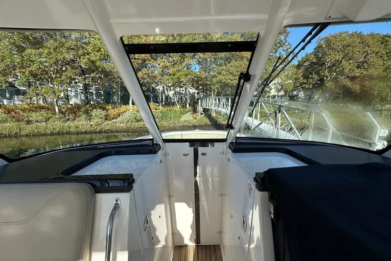 Soul Mates Yacht Photos Pics 2016 Pursuit DC 325 Dual Console boat interior with scenic waterfront view.