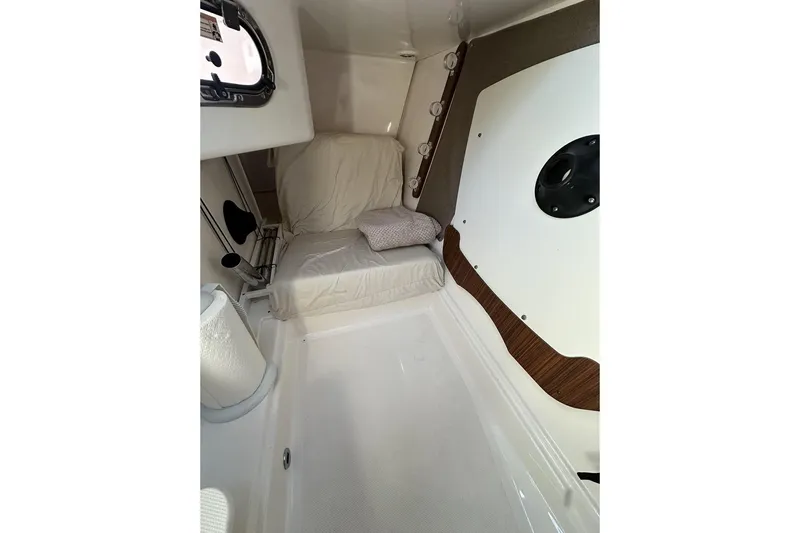 Soul Mates Yacht Photos Pics 2016 Pursuit DC 325 Dual Console cabin interior with cushioned seating and modern design.