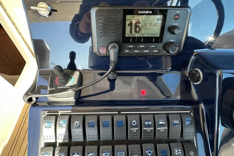 Soul Mates Yacht Photos Pics Control panel of a 2016 Pursuit DC 325 Dual Console boat with Garmin display.