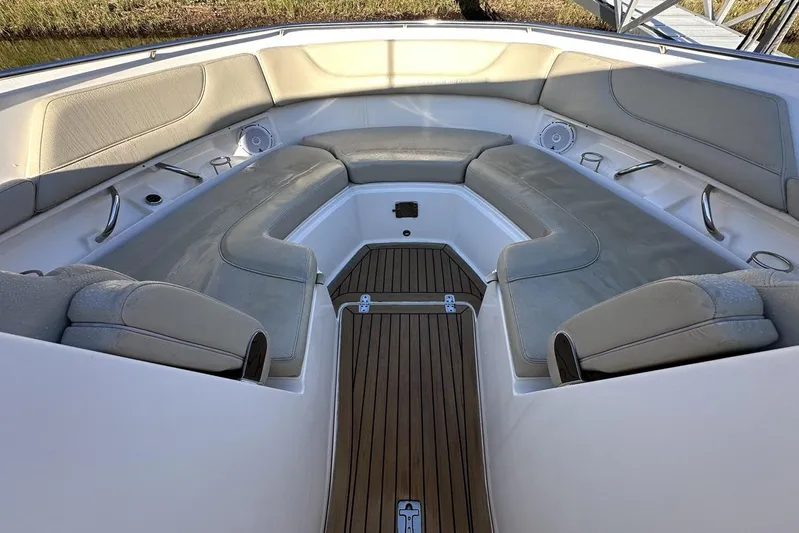 Soul Mates Yacht Photos Pics 2016 Pursuit DC 325 Dual Console boat interior with cushioned seating and teak flooring.