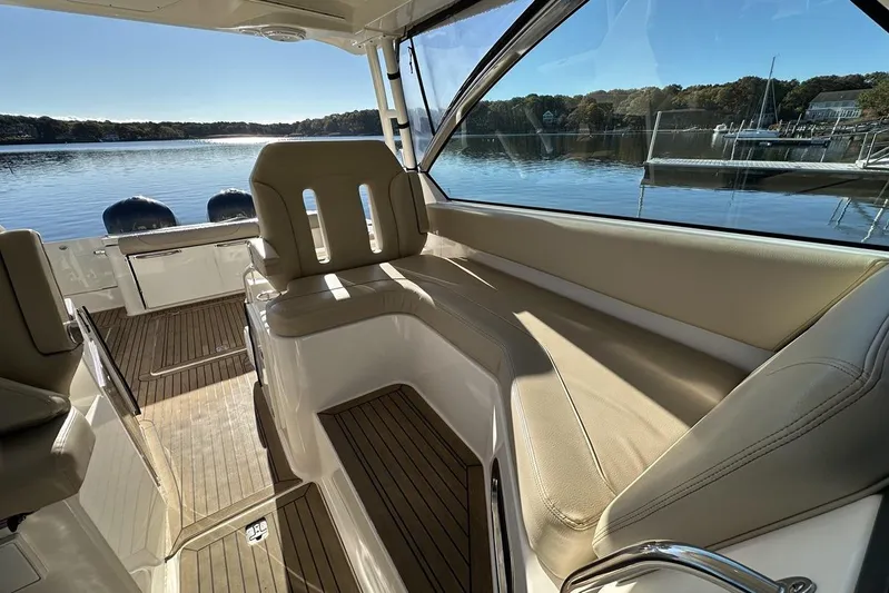 Soul Mates Yacht Photos Pics 2016 Pursuit DC 325 Dual Console interior with beige seating and scenic lake view.