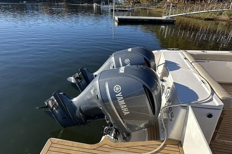 Soul Mates Yacht Photos Pics 2016 Pursuit DC 325 Dual Console with twin Yamaha outboard engines on a calm lake.