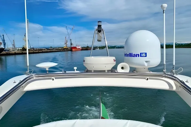  Yacht Photos Pics Ferretti Yachts 550, 2005 model, cruising in a harbor with clear skies.