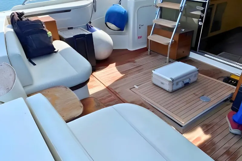  Yacht Photos Pics Luxurious 2005 Ferretti Yachts 550 deck with seating and storage.