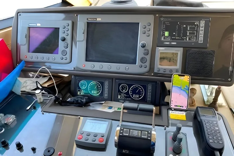  Yacht Photos Pics Control panel of a 2005 Ferretti Yachts 550 with navigation and communication equipment.