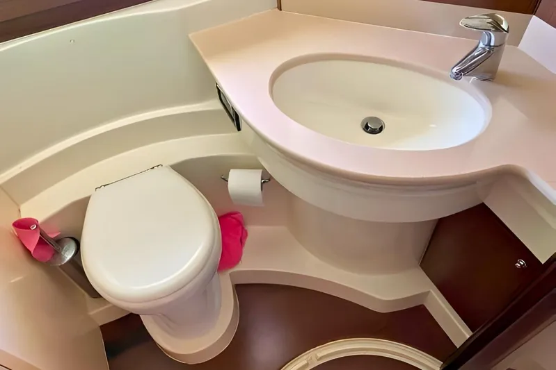  Yacht Photos Pics Luxurious bathroom in 2005 Ferretti Yachts 550, featuring modern sink and toilet.