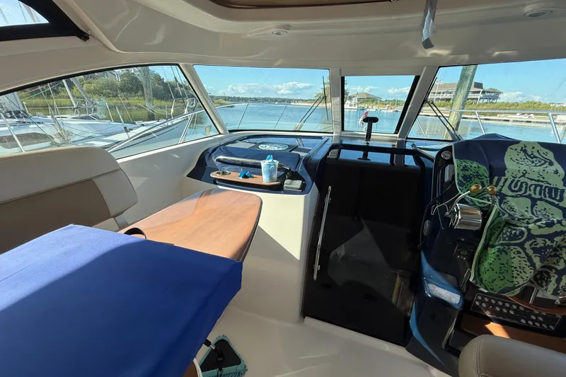  Yacht Photos Pics Interior of 2012 Tiara Yachts 3100 Coronet, featuring helm and seating area.