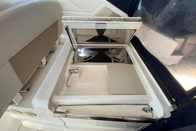  Yacht Photos Pics 2012 Tiara Yachts 3100 Coronet interior with built-in sink and storage compartment.