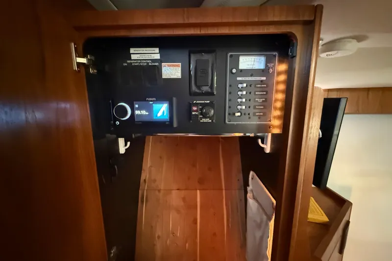  Yacht Photos Pics Control panel inside 2012 Tiara Yachts 3100 Coronet, featuring various switches and displays.