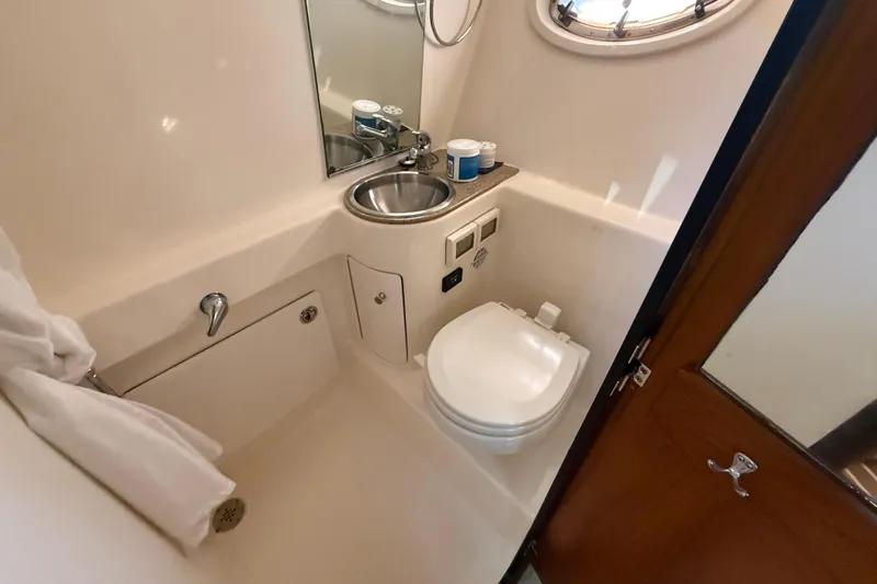 Yacht Photos Pics Compact bathroom in 2012 Tiara Yachts 3100 Coronet, featuring sink and toilet.