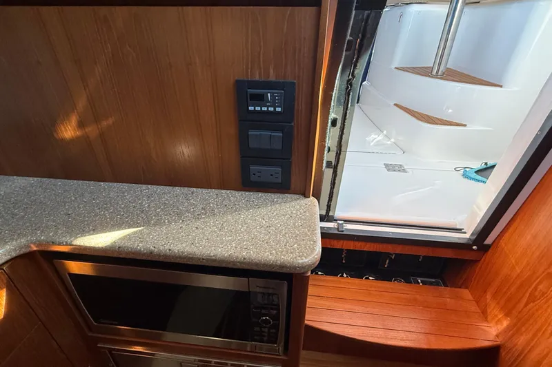  Yacht Photos Pics Interior of 2012 Tiara Yachts 3100 Coronet with wood finish and modern amenities.