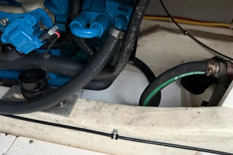  Yacht Photos Pics Engine compartment of a 2012 Tiara Yachts 3100 Coronet with visible hoses and components.