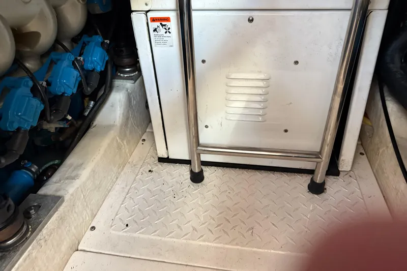  Yacht Photos Pics Engine compartment of a 2012 Tiara Yachts 3100 Coronet with visible components and warning label.