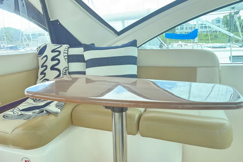  Yacht Photos Pics Interior of 2012 Tiara Yachts 3100 Coronet with cozy seating and nautical decor.