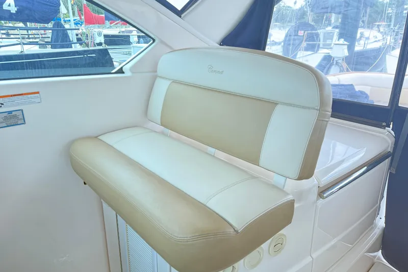  Yacht Photos Pics 2012 Tiara Yachts 3100 Coronet interior seating with beige and white upholstery.