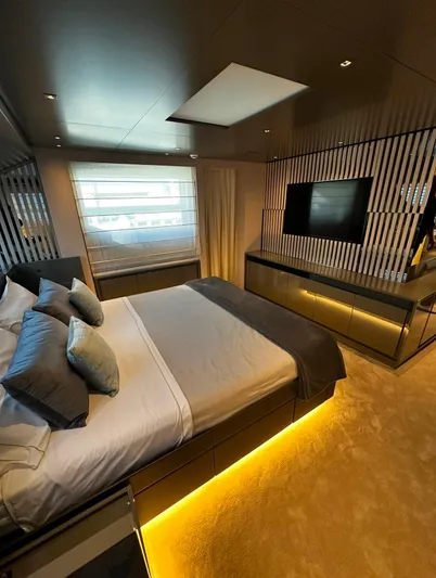 Saam II Yacht Photos Pics Luxurious bedroom interior of 2024 Sanlorenzo SL96 yacht with modern design and ambient lighting.