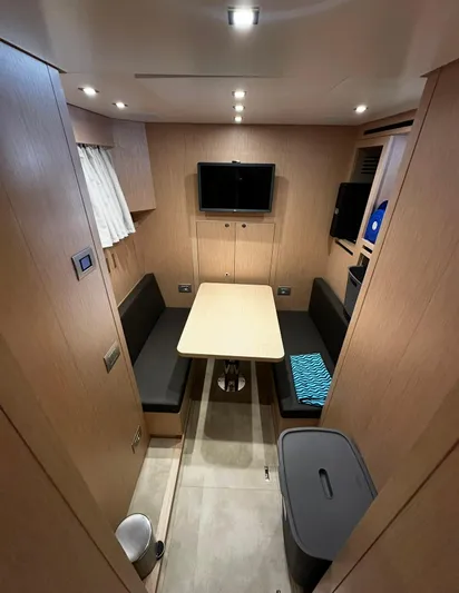 Saam II Yacht Photos Pics 2024 Sanlorenzo SL96 yacht interior with dining area, TV, and modern furnishings.