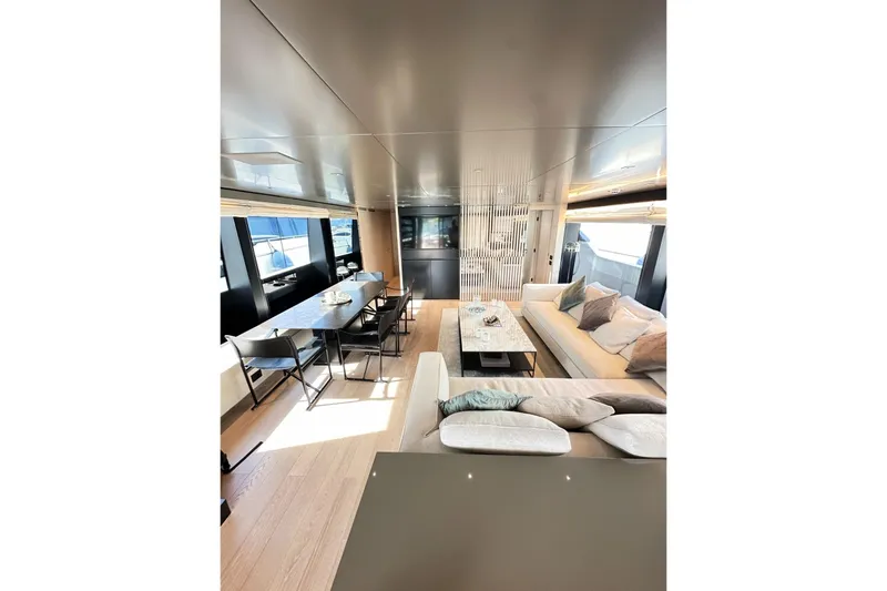 Saam II Yacht Photos Pics Luxurious interior of 2024 Sanlorenzo SL96 yacht with modern dining and seating areas.