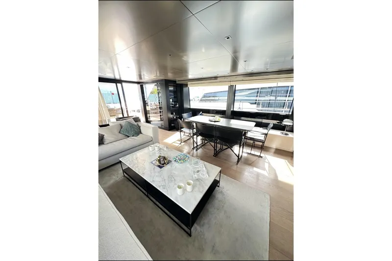 Saam II Yacht Photos Pics Luxurious interior of 2024 Sanlorenzo SL96 yacht with modern furnishings and large windows.
