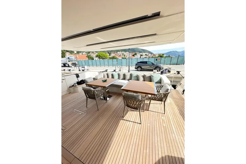 Saam II Yacht Photos Pics Luxurious 2024 Sanlorenzo SL96 yacht deck with elegant seating and dining area.